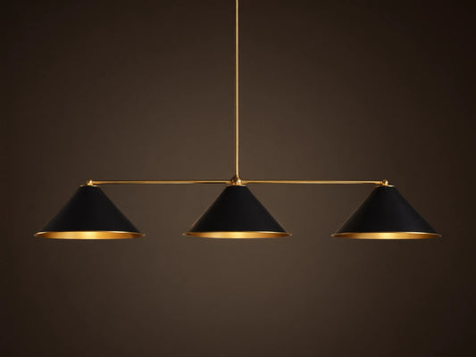 Arno Linear Chandelier with three matte black cone shades and polished brass accents, centered against a neutral wall.