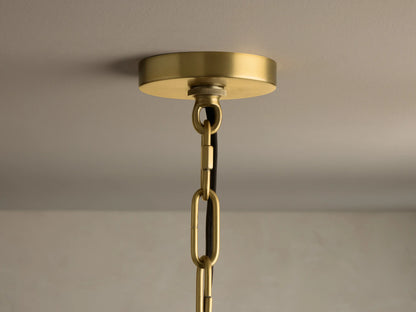 Front view of a gold-toned, three-tier chandelier with clear, textured glass drop-shaped pieces.