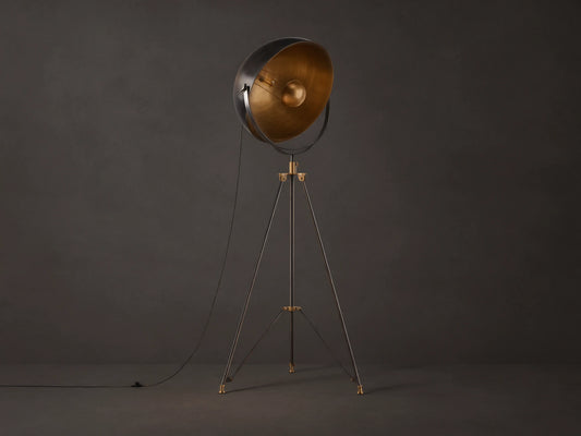 Retro Tripod Floor Lamp with oil-rubbed bronze tripod base & antique brass accents. Round shade has dark exterior, golden interior.