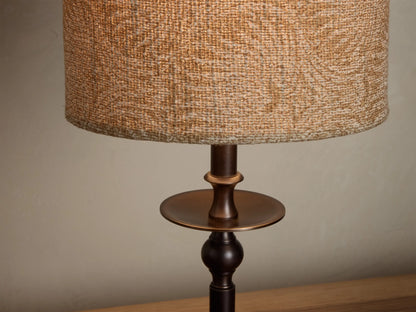 Illuminated Winslow Accent Table Lamp with natural woven fabric shade and dark bronze candlestick base.