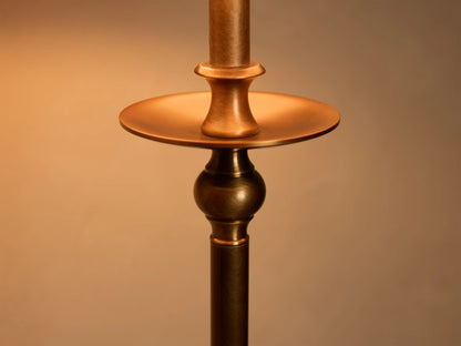 Close-up of the antique bronze Winslow Table Lamp's stem, featuring a circular disc and a spherical accent.