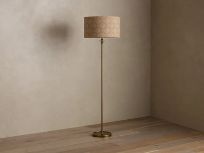 Front view of the Winslow Floor Lamp with an antique brass finish and a beige patterned fabric shade.