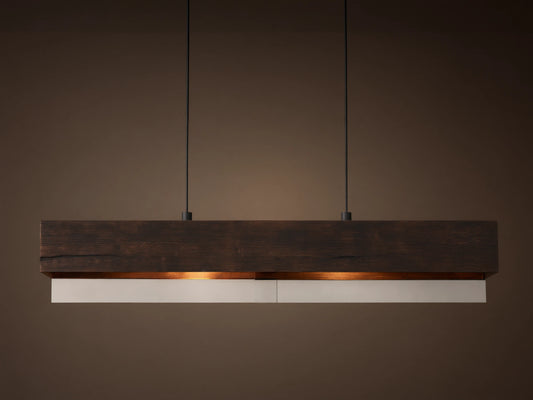 Lena Linear Chandelier: A rectangular dark wood beam with textured grain, featuring mirrored glass below, emitting a warm glow, suspended by black cords.