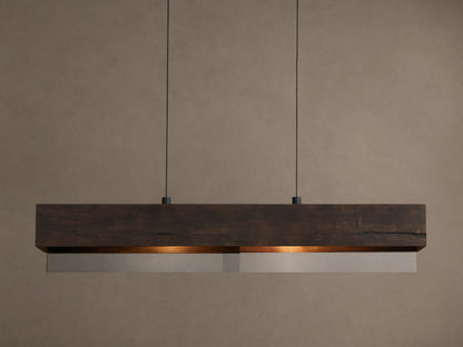 Lena Linear Chandelier: A rectangular dark wood beam with textured grain, featuring mirrored glass below, emitting a warm glow, suspended by black cords.