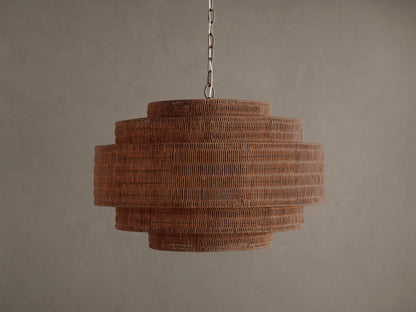 Paloma Chandelier with a tiered, cylindrical handwoven brown rattan shade, suspended from a metal chain against a plain background.