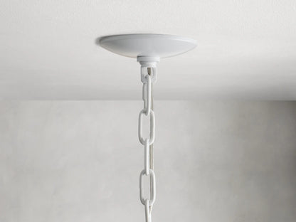 Paloma Chandelier with layered, handwoven rattan shade in a warm white color, showing intricate texture and soft curves.