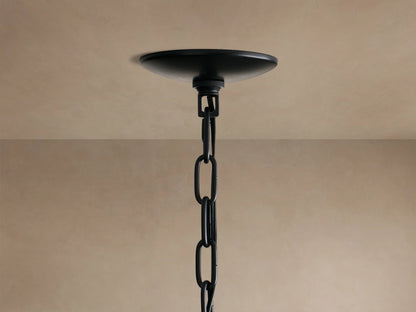 Paloma Chandelier: Close-up of its dark grey, layered handwoven rattan shade, intricate texture visible.