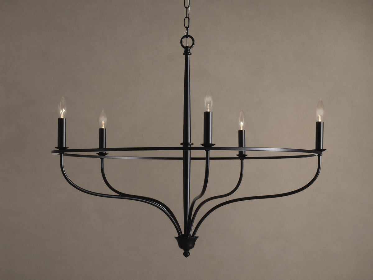 Rosalind Chandelier, matte black, with five lit candelabra bulbs on a circular frame, suspended by a chain.