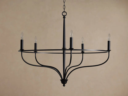 Rosalind Chandelier, matte black, with five lit candelabra bulbs on a circular frame, suspended by a chain.