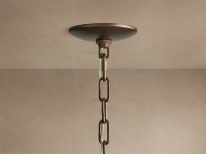 Close-up of Paloma Chandelier's tiered, handwoven rattan shade in natural brown, showing distinct vertical weave texture.