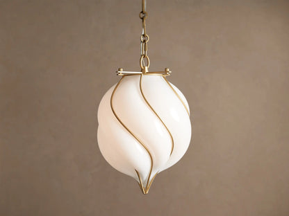 Margolis Small Pendant: White hand-blown glass shade with swirling brass-finished iron bands, hanging from a chain.