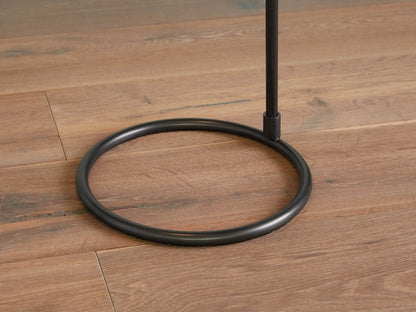 Close-up of Kellen Floor Lamp's adjustable oil-rubbed bronze arm holding a large, light cream linen shade against a warm wall.