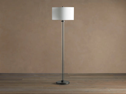 Glass Column Floor Lamp with a tall, clear glass column, dark metal base & top, and a white cylindrical linen shade.