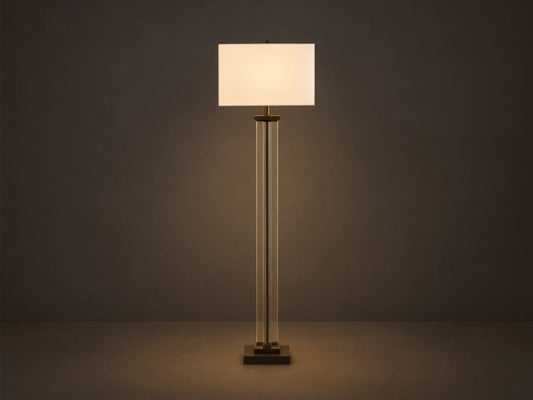 Dawson Floor Lamp with rectangular white shade, clear crystal and iron stand, on wooden floor, against a light gray wall.