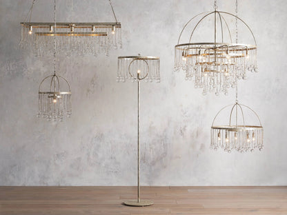 Aubrey Rectangular Chandelier with a silver handcrafted iron frame, hanging Italian glass crystals, and five glowing bulbs.