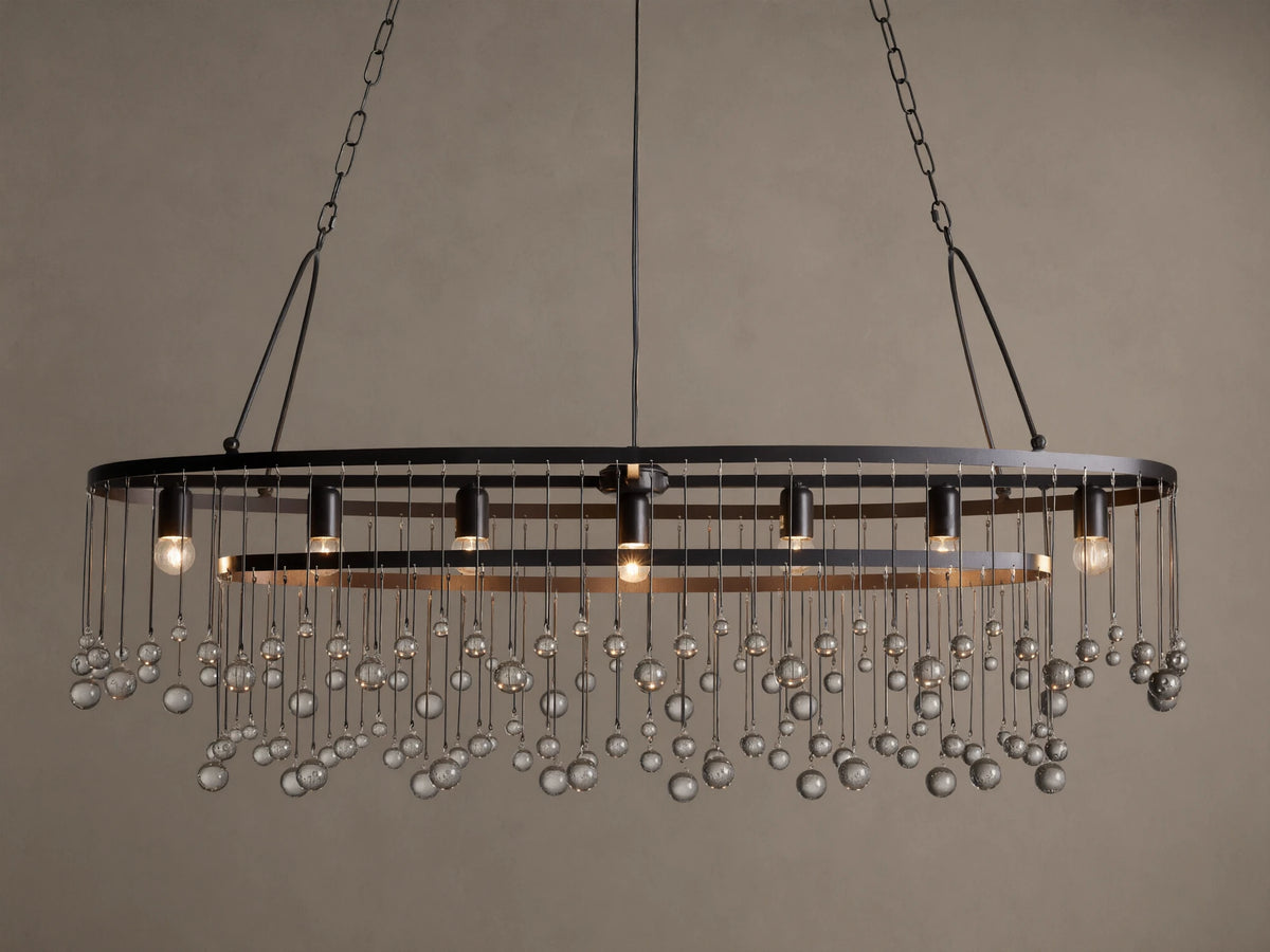 Aubrey Oval Chandelier: Dark iron oval frame with exposed bulbs & numerous hanging clear glass beads.