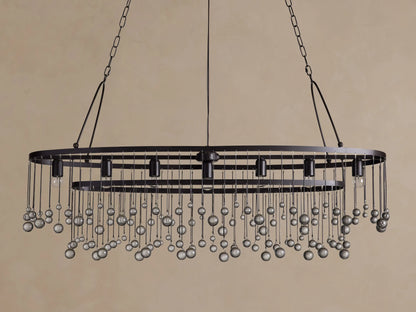 Aubrey Oval Chandelier: Dark iron oval frame with exposed bulbs & numerous hanging clear glass beads.