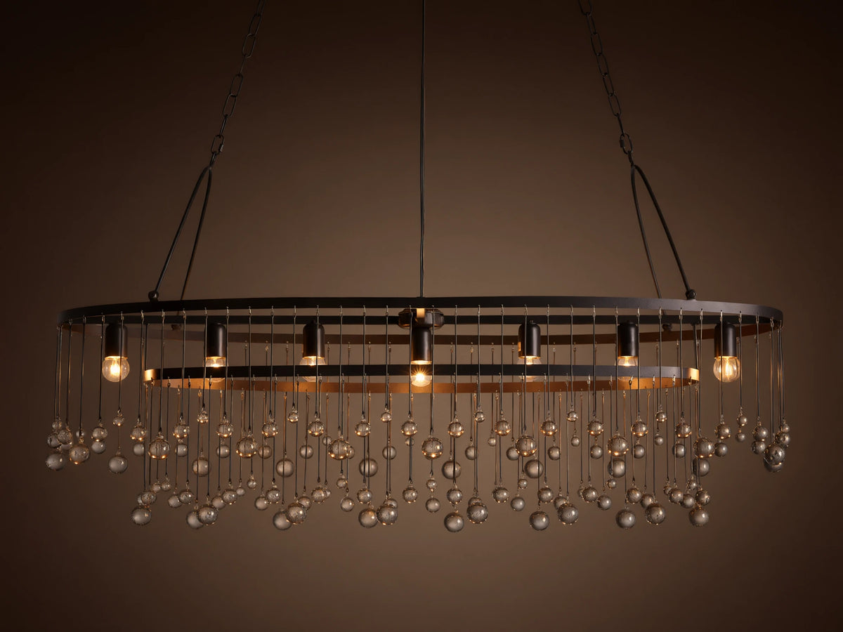 Aubrey Oval Chandelier: Dark iron oval frame with exposed bulbs & numerous hanging clear glass beads.