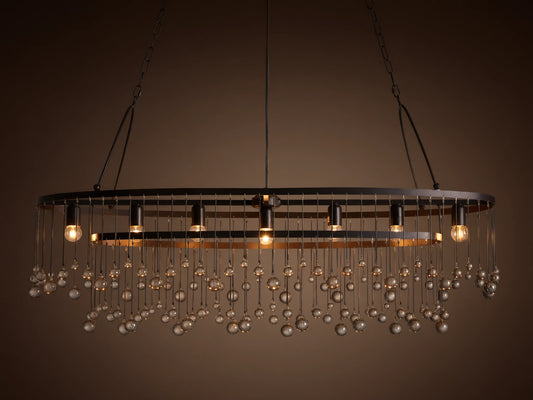 Aubrey Oval Chandelier: Dark iron oval frame with exposed bulbs & numerous hanging clear glass beads.