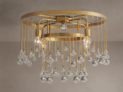 Aubrey Flush Mount light fixture, gold iron frame, dangling clear glass spheres, and visible bulbs, mounted on a ceiling.
