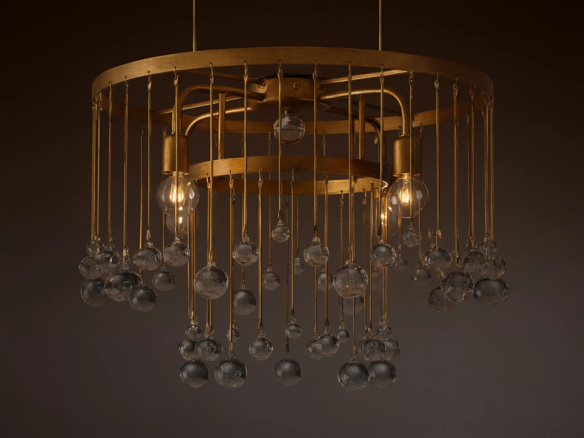 Aubrey Flush Mount light fixture, gold iron frame, dangling clear glass spheres, and visible bulbs, mounted on a ceiling.