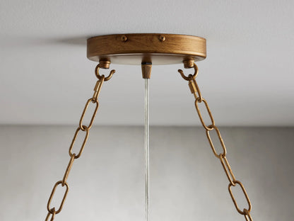 Oval chandelier made of solid iron with a gold finish, featuring hanging glass spheres on slim rods, creating an elegant look.