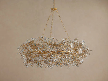 Luxurious gold-toned Fiore Crown Chandelier with a circular, branch-like frame adorned with sparkling clear crystal blossoms.