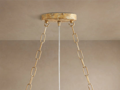 Fiore Linear Chandelier close-up: golden branches with clear faceted crystal flowers and buds, sparkling with light.