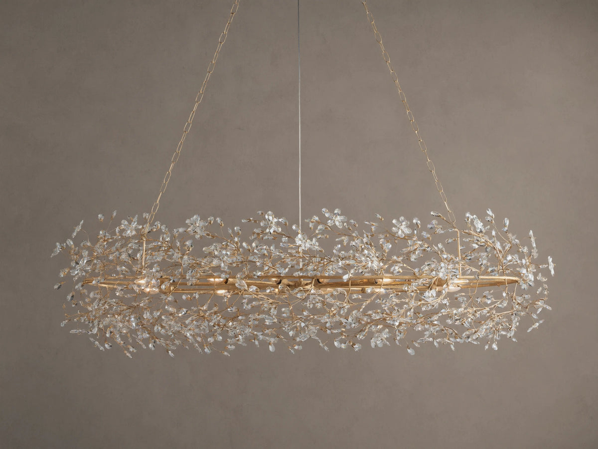 Fiore Oval Chandelier: gold-toned, oval iron frame adorned with myriad sparkling clear crystal leaves, hanging.