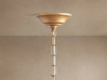 Close-up of Fiore Crown Chandelier with antiqued gold branches and faceted amber/cognac crystal teardrops and flowers.