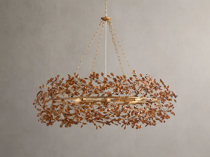 Fiore Crown Chandelier with golden antiqued leaf design, hanging by iron chains, features intricate floral patterns and multiple bulb sockets.