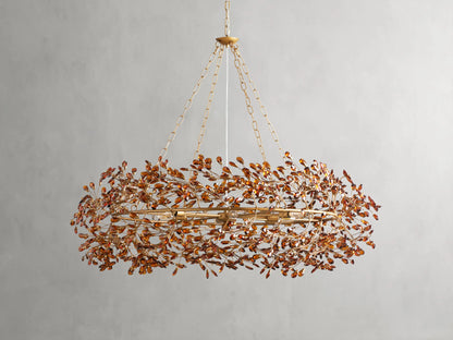 Fiore Crown Chandelier with golden antiqued leaf design, hanging by iron chains, features intricate floral patterns and multiple bulb sockets.
