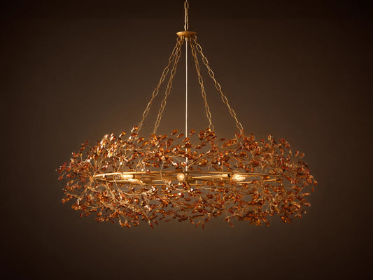 Fiore Crown Chandelier with golden antiqued leaf design, hanging by iron chains, features intricate floral patterns and multiple bulb sockets.