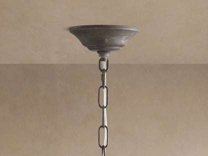 Fiore Crown Chandelier: Dark antiqued metal canopy mounted on a ceiling, with a matching chain and intertwined wires.