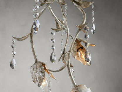 Viticcio Pendant featuring hand-molded silver-finished iron with elegantly strung clear faceted glass crystals, suspended against a gray background.