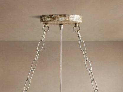 Fiore Oval Chandelier, silver with many sparkling clear crystal leaves, suspended by chains against a neutral background.