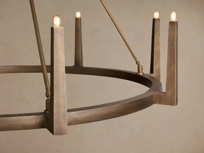 Emmet Round Chandelier with antiqued brass finish, round, featuring ten upward-pointing lights, suspended from ceiling.