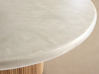 Alesso Outdoor Round Dining Table, cream concrete composite top, light brown fluted reclaimed teak wood cylindrical base.