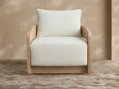 Light grey Anami outdoor collection cover draped over a chair, front view. It has a central seam and a split bottom opening.