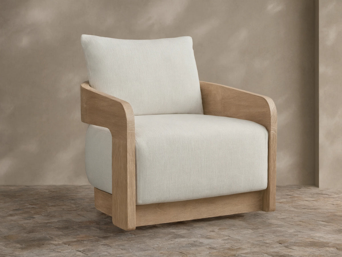 Anami Outdoor Swivel Chair with light teak wood frame, curved arms, and thick cream cushions, shown from a front-right angle.