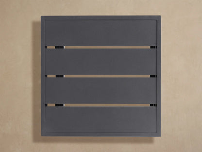 Angled close-up of dark gray Bal Harbour Outdoor Aluminum End Table. Top has parallel indented lines and textured finish.