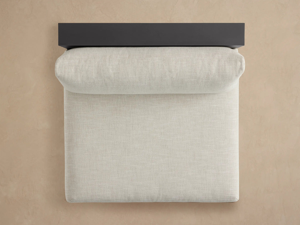 Bal Harbour armless chair, dark gray aluminum frame with light beige cushions, featuring an integrated slatted shelf on the right side.