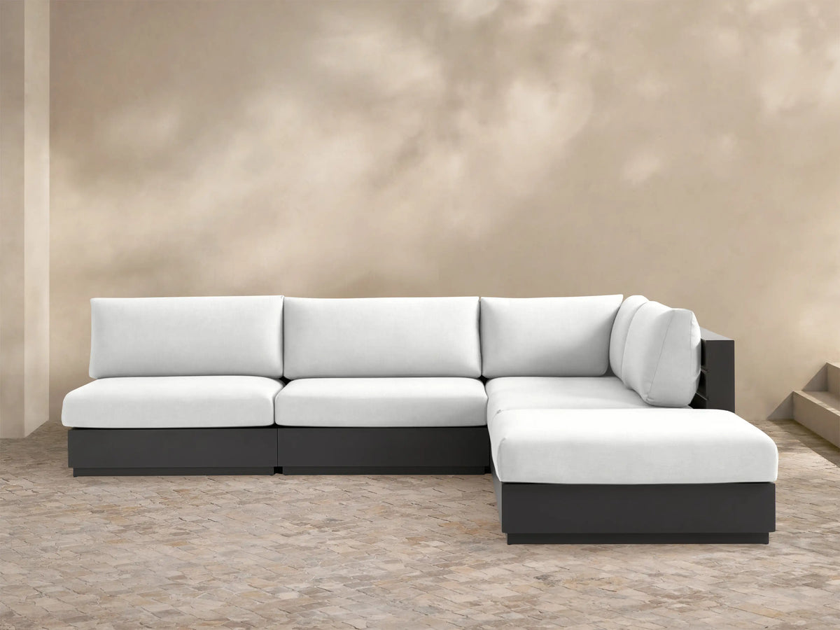 Bal Harbour 5-piece outdoor sectional with white cushions and dark gray aluminum frame on a tiled patio.