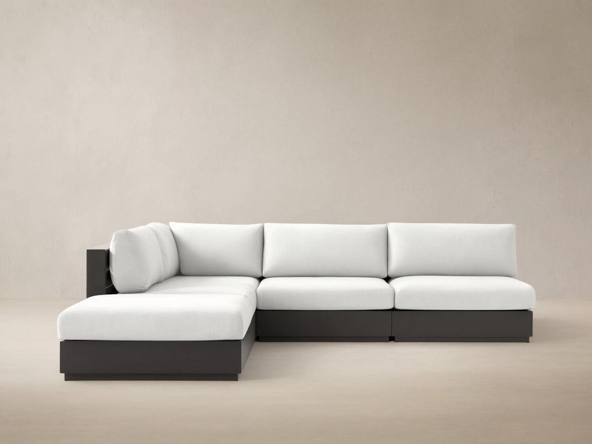 Bal Harbour 5-piece outdoor sectional with white cushions and dark gray aluminum frame on a tiled patio.