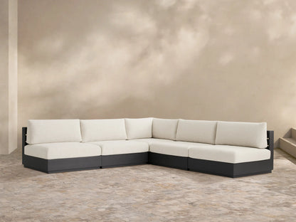 Bal Harbour Outdoor Aluminum Sectional, dark gray frame with off-white cushions, L-shaped on a light patio.