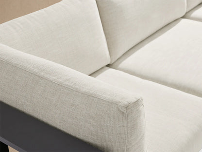 Bal Harbour outdoor aluminum 5-pc sectional in L-shape with dark gray frame, light cushions, built-in shelf, & ottoman on patio.