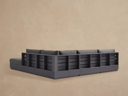 Close-up of charcoal grey Bal Harbour Outdoor Sectional cushions with a dark grey aluminum frame and side storage.