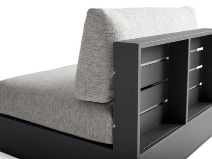 Bal Harbour armless outdoor chair, dark gray aluminum frame with slatted back detail, light gray cushions. Angled rear view.