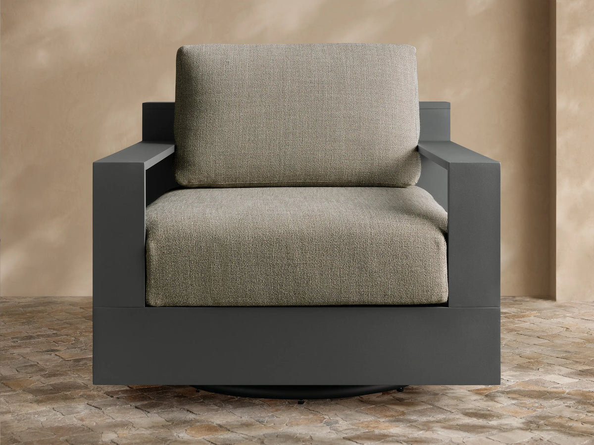 Front view of Bal Harbour Outdoor Aluminum Swivel Chair, an armchair with light beige cushions and dark gray frame.