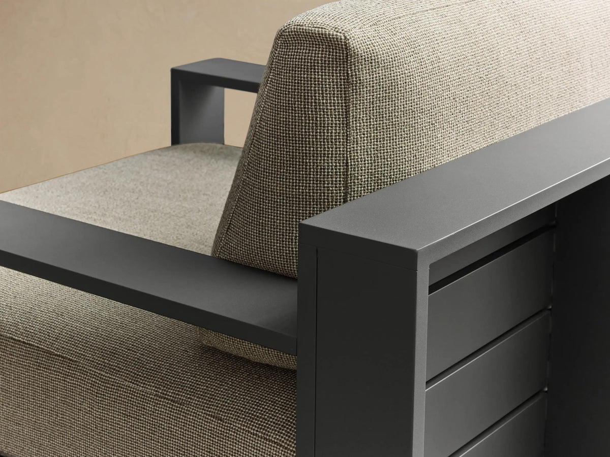Front view of the dark gray Bal Harbour Outdoor Aluminum Swivel Chair with light beige woven cushions and a visible swivel base.